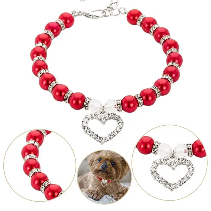 10030-58a0c4.jpg, with a heart-shaped pendant, accented with pearls, shown in close-up and worn by a small dog.