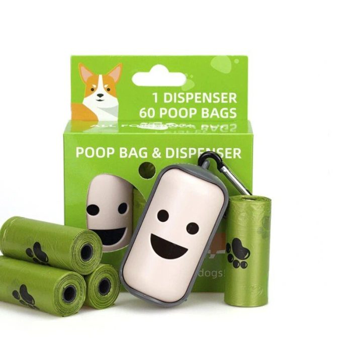 Photo of a portable poop bag dispenser with a smiling face, four rolls of green poop bags, and packaging that reads "1 Dispenser 60 Poop Bags." The packaging features an image of a Corgi dog and paw prints. Product Name: 10207-10bc4e.jpg