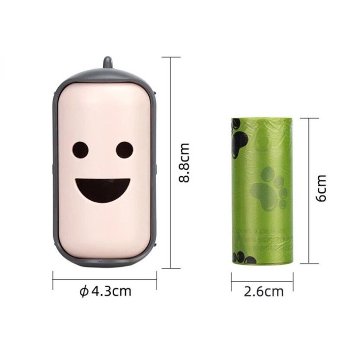 A pink, smiling face-shaped pill box measuring 8.8cm by 4.3cm is beside a green paw-print patterned portable canvas poop bag dispenser for pets, measuring 6cm by 2.6cm, on a white background (10207-f56903.jpg).