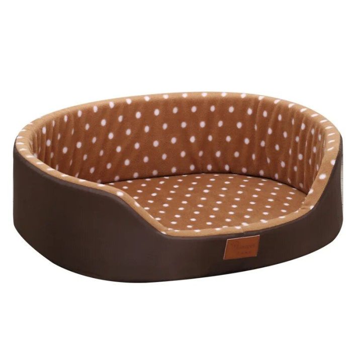 A cozy brown oval 10233-fc8530.jpg with a charming dot-patterned interior cushion. The bed features a raised back and sides with a lower front edge for easy access.