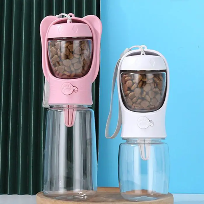 Two 10329-a56ba2.jpg, one pink and one white, stand on a surface. Each bottle has kibble inside the top section and a clear water container below.