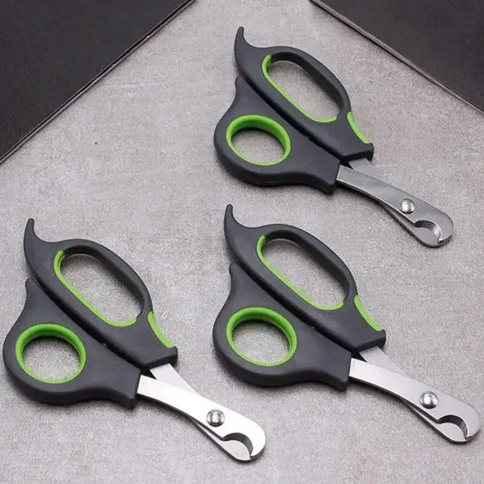 Three identical 10538-5f4f70.jpg with hook-shaped blades, also perfect as pet nail clippers, are placed on a gray surface.