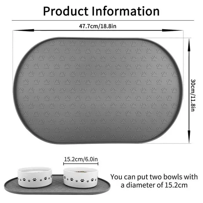 A grey pet feeding mat with a paw print pattern, measuring 47.7cm x 30cm, shown with two white bowls. Caption reads: "You can put two bowls with a diameter of 15.2cm." [Product Name: 10573-054cf5.jpg]