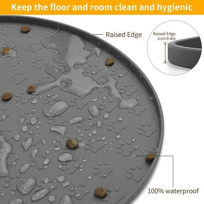 Close-up of a 10573-b09e33.jpg with raised edges, showing water droplets and scattered kibble. The inset highlights the 1 cm raised edge designed to keep floors clean from spills and mess.