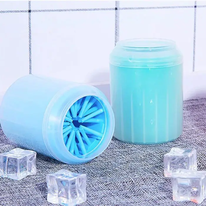 Two plastic containers with removable lids sit on a fabric surface, surrounded by ice cubes, much like the 10610-ae0e5d.jpg. One container is tipped over, revealing its swirling blue interior.