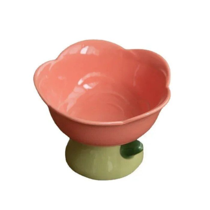 A pink, flower-shaped ceramic pet bowl with a green base (10869-0a52fb.jpg).