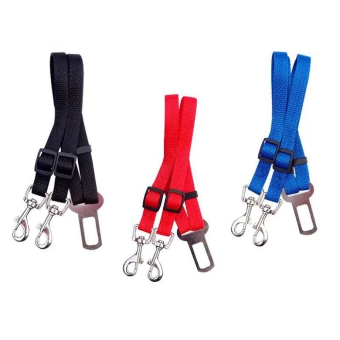 Three 10926-7e1ba2.jpg are shown in three colors: black, red, and blue. Each seat belt features adjustable straps with metal clips and seat belt buckles for securing dogs while traveling in a vehicle.