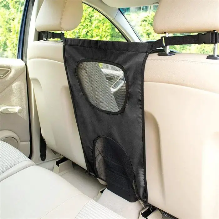 A 11015-4c555b.jpg is installed between the front and rear seats of a car, securely attached to the headrests.