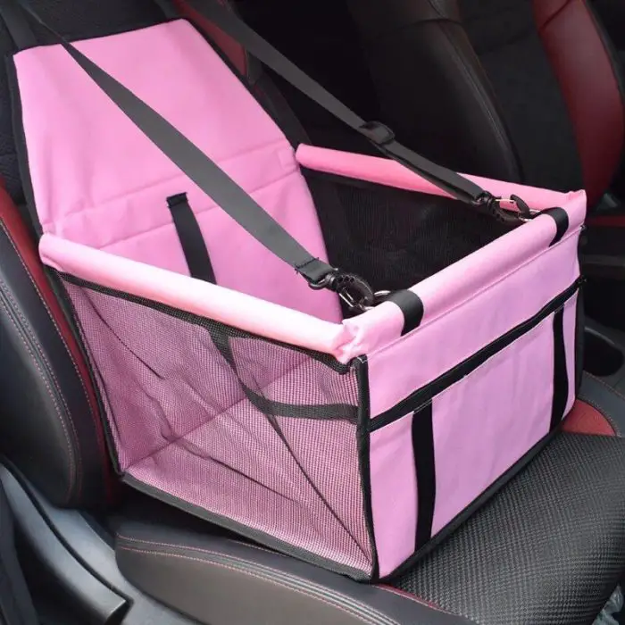 Pink 11080-4a5072.jpg with mesh sides attached to the passenger seat of a car.