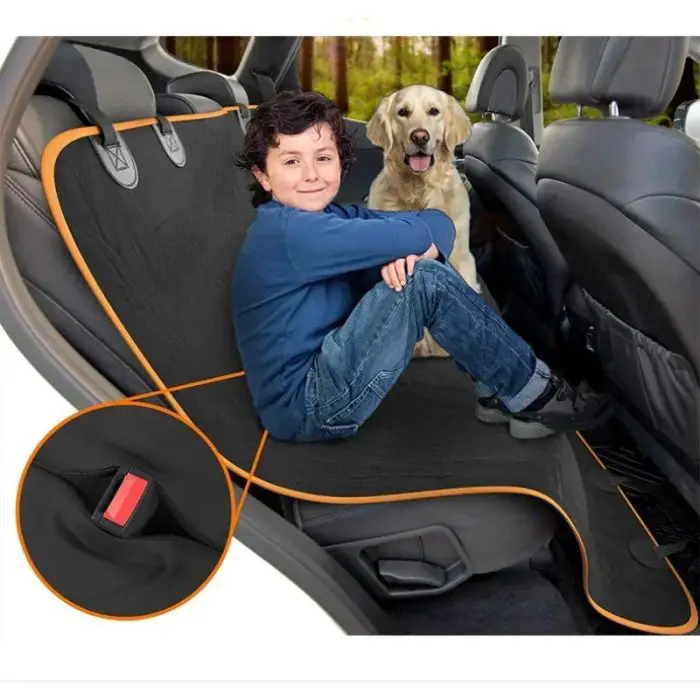 A child sits comfortably on a 11089-846cf5.jpg in a car, accompanied by a dog sitting beside them. The cover features an inset pocket and orange trim.