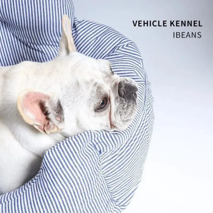 A French Bulldog rests on a blue and white striped dog bed, titled "11111-f5cb4c.jpg" in the top right corner, doubling as a stylish pet car seat.