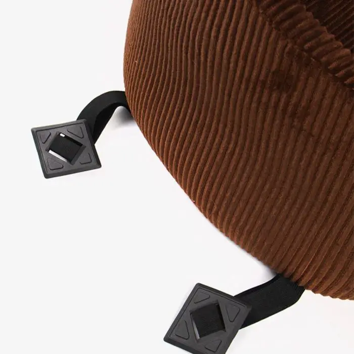 Close-up of a brown ribbed fabric item designed for a luxury dog car seat, featuring two black elastic straps ending in two black plastic clips, 11114-a7f7ae.jpg.