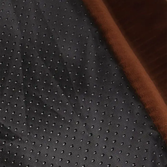 Close-up view of a luxury dog car seat, showcasing a fabric with a black, dotted pattern next to a dark brown, textured material. Product name: 11114-fa3fcc.jpg.