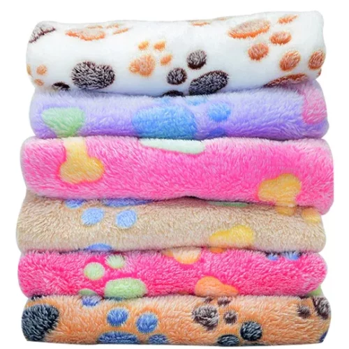 A stack of six colorful, fluffy blankets featuring various paw print patterns, arranged from top to bottom in white, purple, pink, beige, yellow, and orange colors is a delightful and cozy addition to any home. Product Name: 11395-78848d.webp