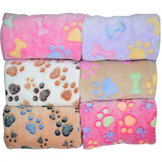 Six rolled-up 11395-d6beae.webp with paw and bone patterns in various hues including pink, purple, white, brown, beige, and light brown. Each blanket is soft and cozy, perfect for adding a touch of whimsy to any space.