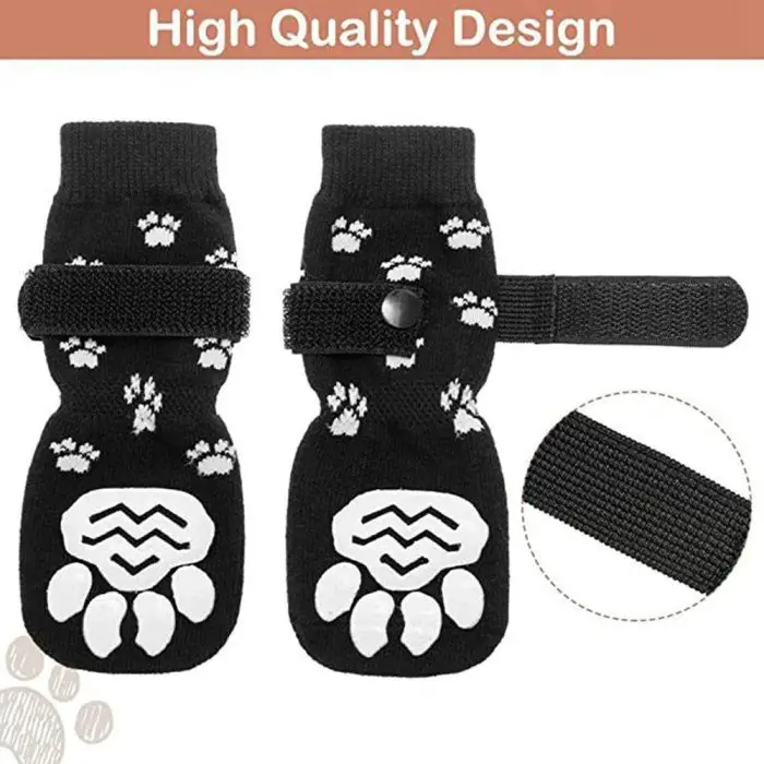 Black pet dog socks adorned with white paw prints and featuring paw-shaped non-slip grips, plus Velcro straps for a secure fit. The text at the top reads "High Quality Design." Item reference: 11723-1b333b.jpg