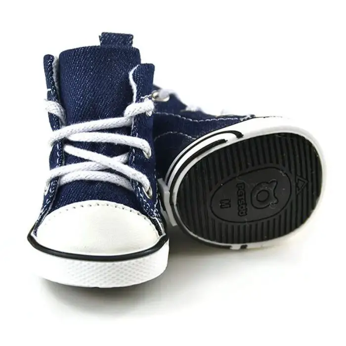 A pair of small, navy blue toddler sport shoes with white laces and rubber soles, shown in the product image 11821-f7de3b.jpg, are displayed against a white background.