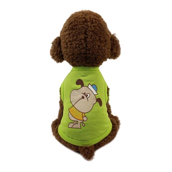 A plush toy dog named 11882-1a415f.jpg sits with its back to the viewer, donning a green shirt adorned with a colorful cartoon dog print.