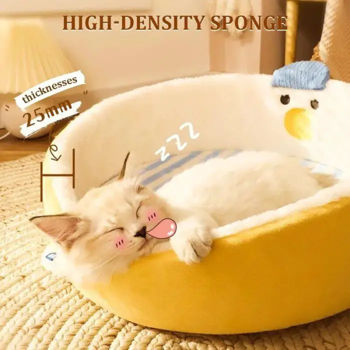 A sleeping kitten with a cartoonish pink tongue and cheeks rests in a round, yellow cat bed on a woven mat. The visual depiction includes the text "HIGH-DENSITY SPONGE," indicates "thickness 25mm," and features an accompanying height illustration, all visible on product image 12439-0935a6.jpg.