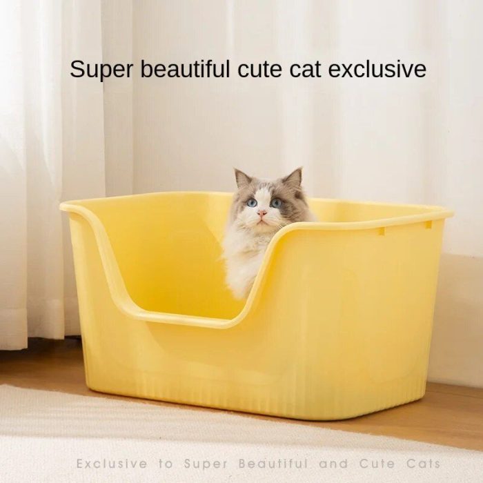 A fluffy cat with blue eyes sits inside a yellow plastic bin that resembles a cat litter box, placed on a wooden floor near white curtains, as seen in the product image 12588-212951.jpg.