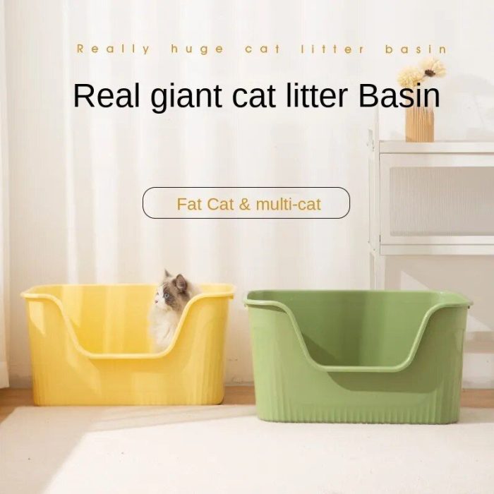 Two large cat litter boxes, one yellow and one green, placed side by side on the floor. A cat is sitting inside the yellow box. Upper text reads "Real giant cat litter box" and "Fat Cat & multi-cat". The product image name is 12588-74e410.jpg.