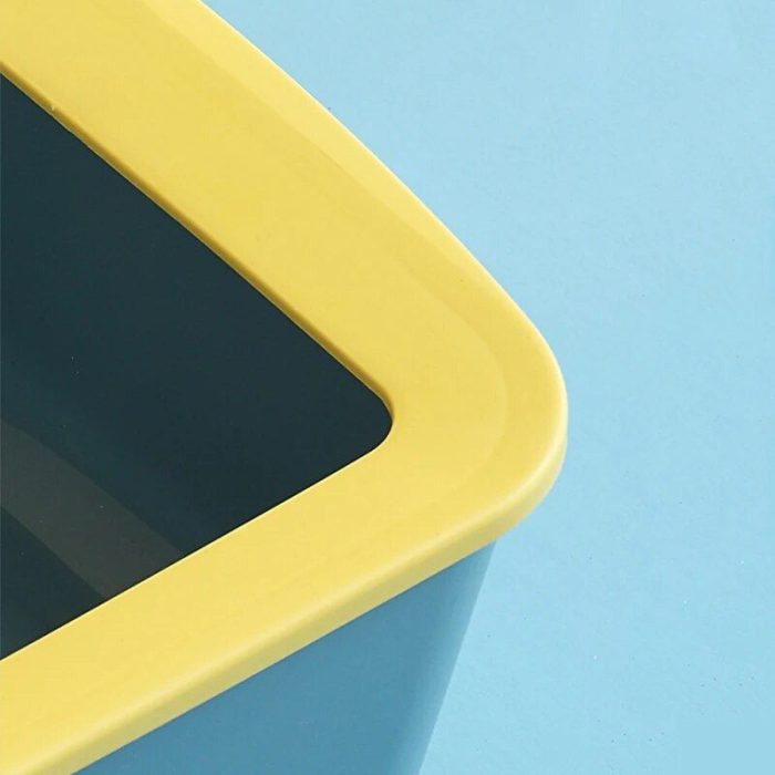 Close-up of the 12589-da0552.jpg product, which is a rectangular plastic container with a yellow rim and blue sides, resembling a cat litter box, set against a light blue background.