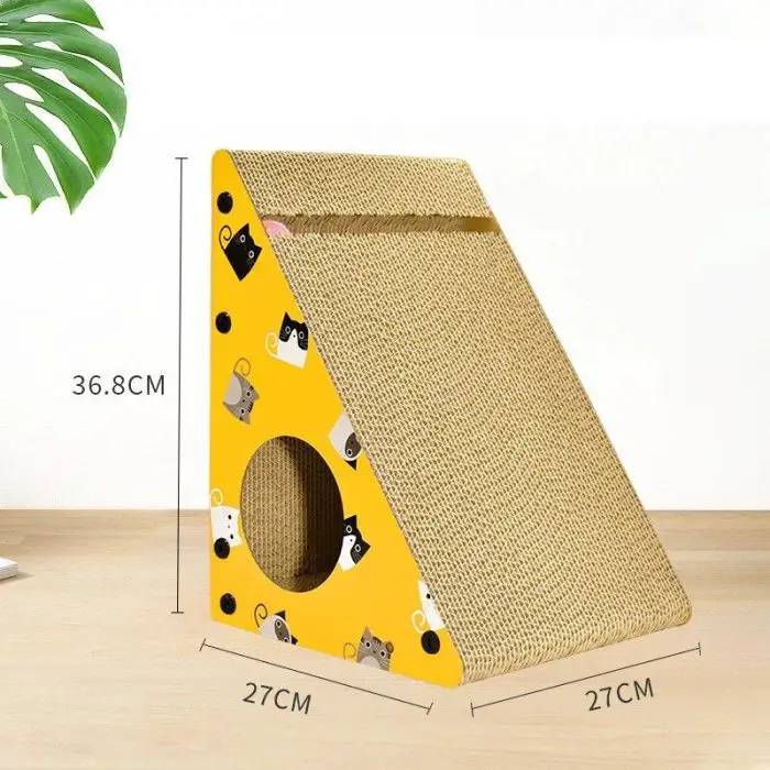 A triangular cat scratching post with dimensions of 36.8cm in height, 27cm in width, and 27cm in depth stands on a wooden surface. It is decorated with cartoon cat faces and mice illustrations and is referred to by its product image filename: 12708-e7de53.jpg.