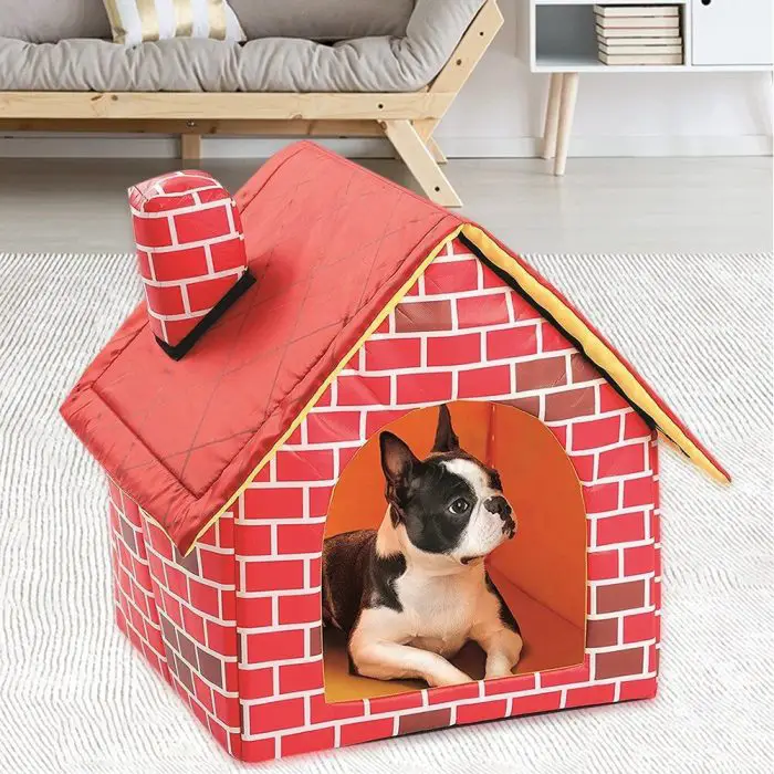 A small black and white dog is resting inside a red and yellow doghouse, as depicted in the image file 12747-8d95f4.jpg, which features a design that mimics a brick house with a chimney.