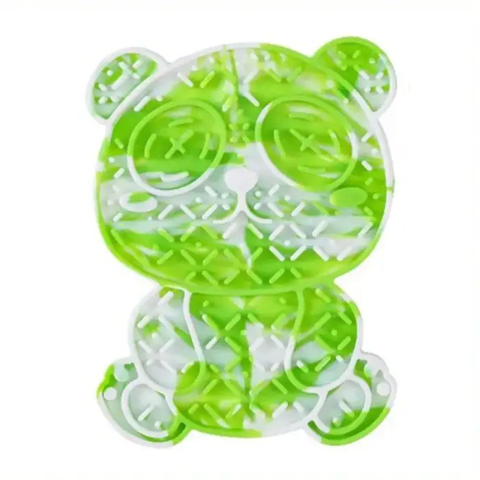 Introducing the 12990-e5098c, a green bear-shaped silicone chew toy featuring textured surfaces perfect for teething. Designed with closed eyes, a nose, and an upright sitting position with a smiling face, this adorable toy is an excellent mealtime solution for pets. It doubles as a silicone slow feeder mat to keep your furry friends engaged and happy.