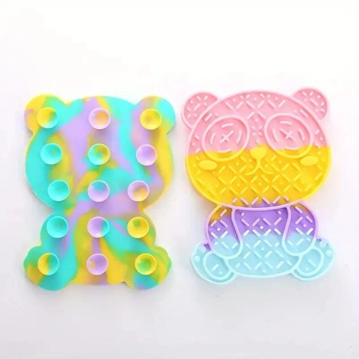 Two colorful silicone pop-it toys: one in the shape of a teddy bear with a multicolor pattern and the other shaped like a panda bear with a pastel gradient design. These engaging toys are perfect not just for fun, but can also double as Bear-Shaped Silicone Slow Feeder Mats, making mealtime for pets more interesting.