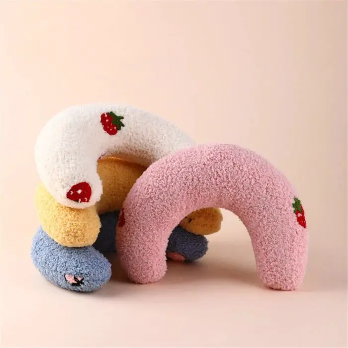 Stacked 9508-7f541f.jpg in various colors including white, yellow, pink, and blue, each adorned with small strawberry and flower designs. These 9508-7f541f.jpg not only add comfort but are also perfect for small dogs and cats to curl up against a plain background.