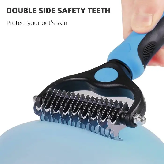 A hand holding an ultimate blue and black 9678-3e5e65.jpg with metal teeth. Text above reads "Double Sided Safety Teeth Protect your pet's skin.