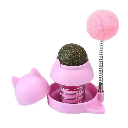 A 9783-ff959a.jpg featuring a spherical green adhesive catnip ball in a spring-loaded base with a removable cover and a pink pom-pom on a spring attached to the side.