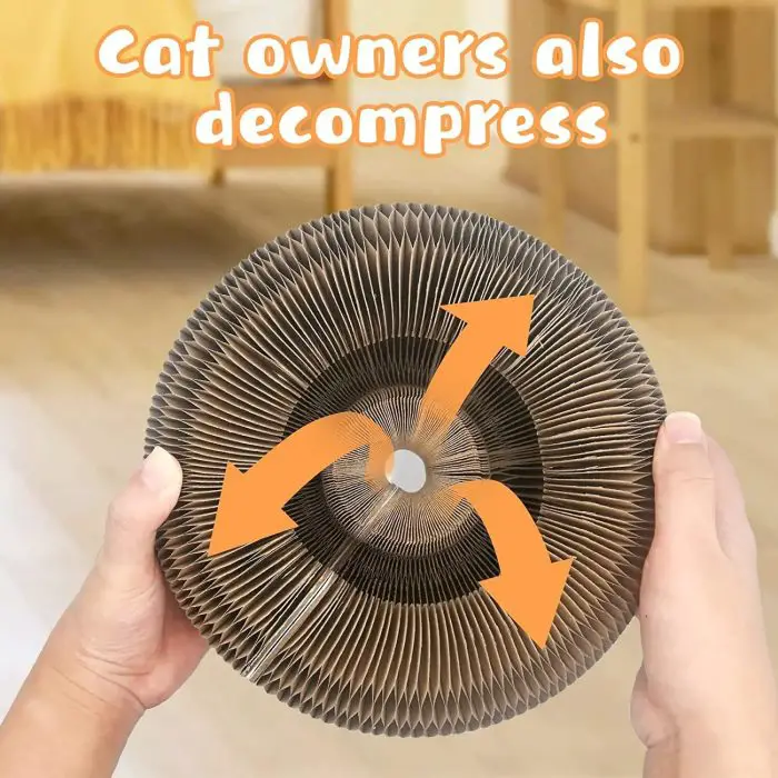 A person holds a round, corrugated cardboard object with large arrows indicating airflow. The text above reads, "Cat owners also decompress with the 9796-9e4520.jpg.