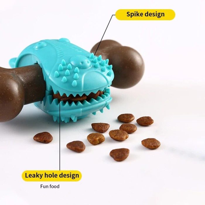 A bite-resistant blue rubber pet chew toy with spike and leaky hole design holds brown kibble. Several pieces of kibble are scattered in front of the 9804-ac0b61.jpg.