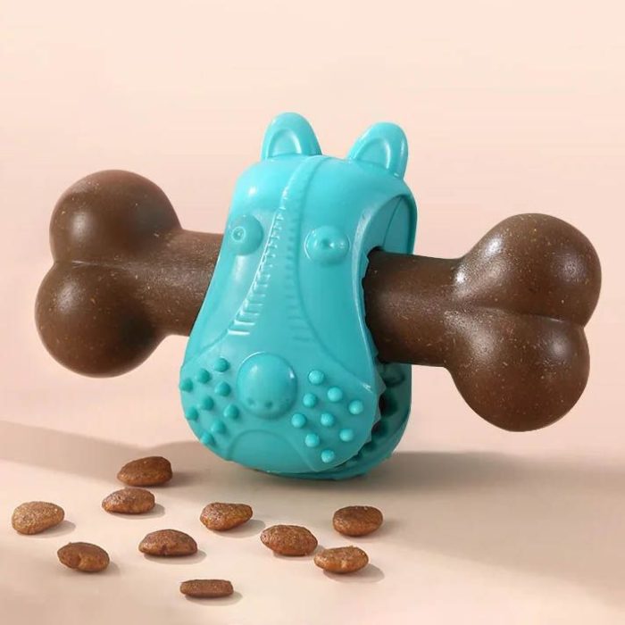 A blue rubber pet chew toy in the shape of an animal holds a brown, bone-shaped chew stick. Small dog treats are scattered on the surface nearby, and its bite-resistant design ensures lasting fun for your pet, 9804-d35256.jpg.