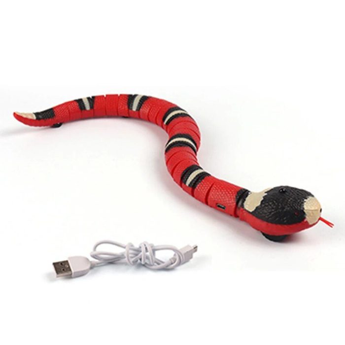 A red and black snake toy with a forked tongue, featuring smart sensing technology, comes with a white USB charging cable named 9828-9c4e53.jpg.